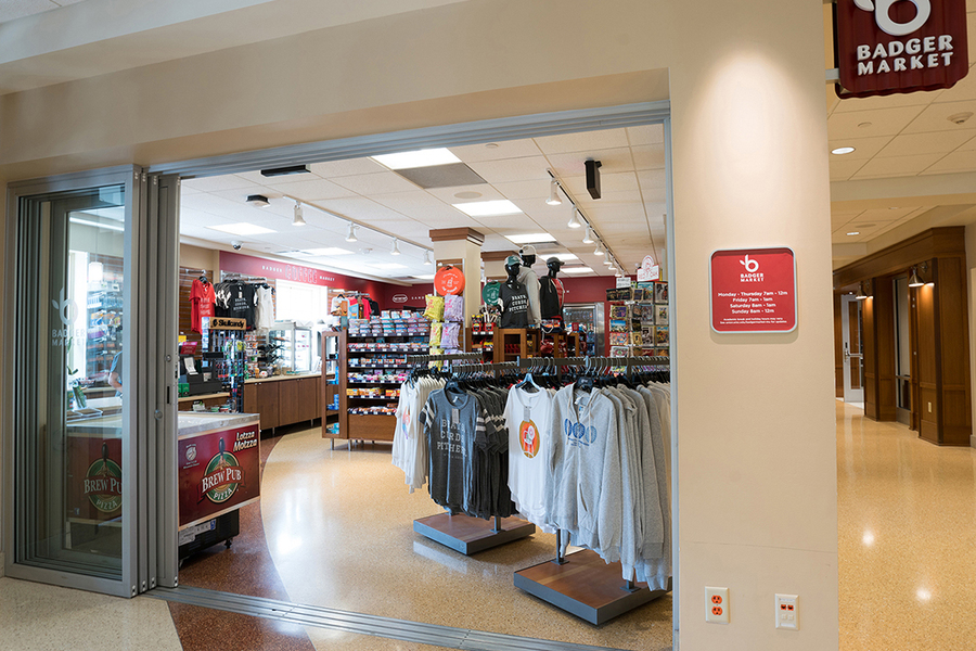 Assorted items, apparel and food on shelves and display stations available for purchase.