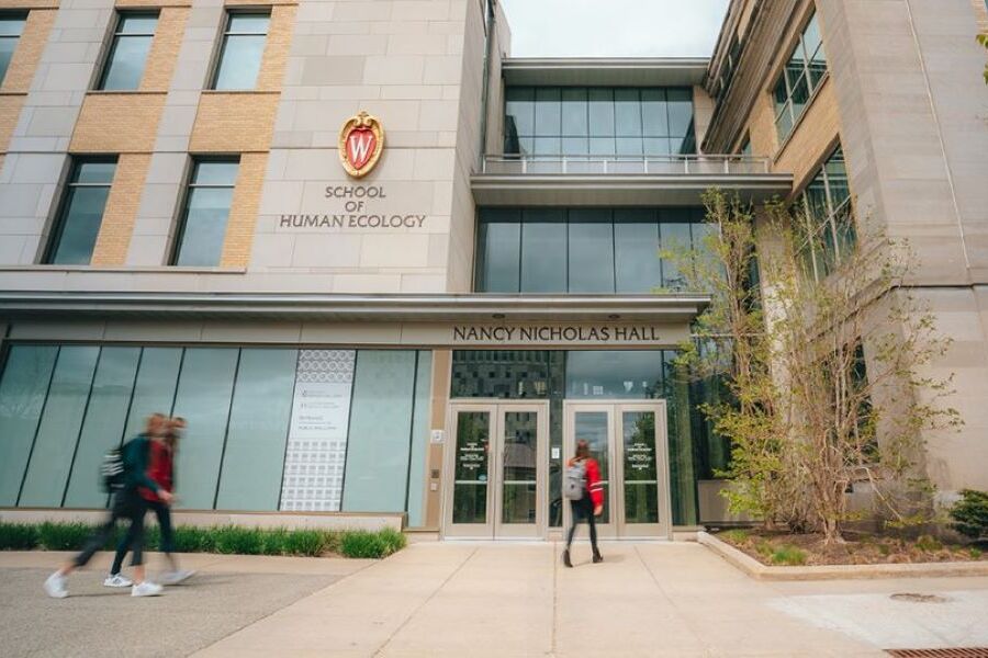 School of Human Ecology- building exterior with students walking. 